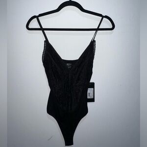 Black Lacey spaghetti strap Marciano body suit. Brand new with tags